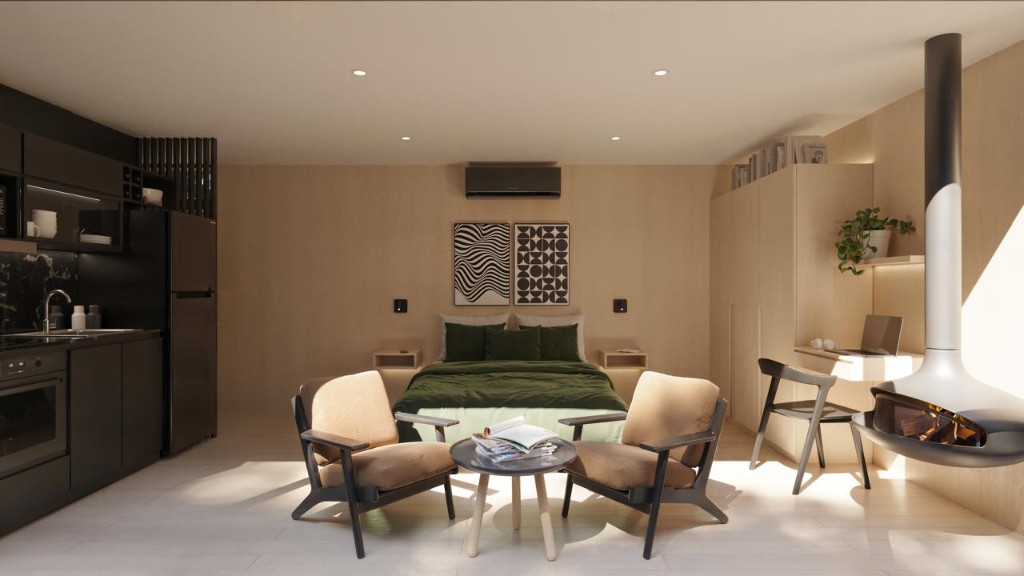 Interior de la cabaña vidriada con living y cocina